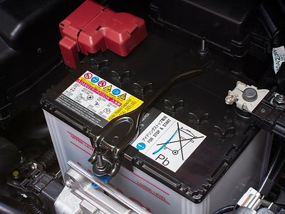 Car battery in it's location under the hood