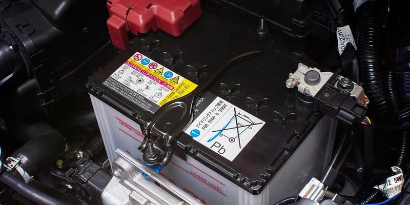 Car battery in it's location under the hood