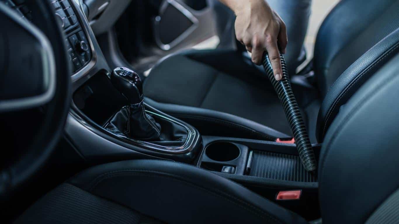 Vacuuming car interior