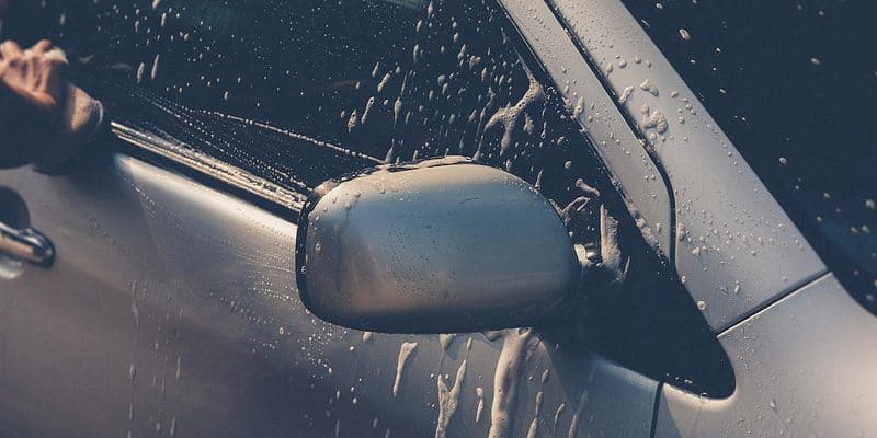 Washing the front side window of a car