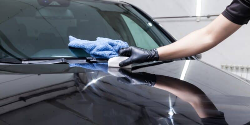 Ceramic coating the hood of a black car