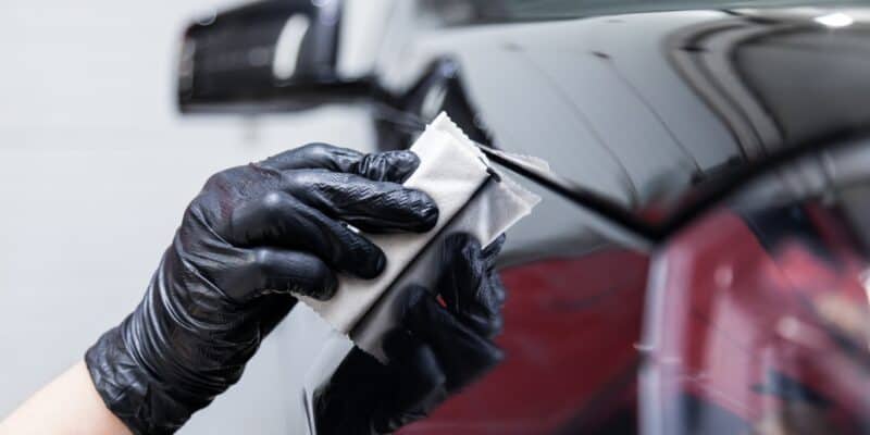 Applying a ceramic coat to a black car