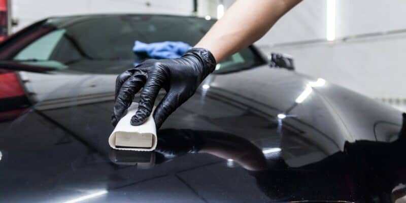 Ceramic coating the hood of a black car